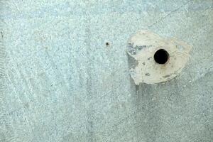 Big Hole on Concrete Wall Texture Background. photo