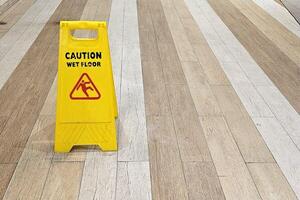 Yellow Caution Pole for Wet Floor. photo