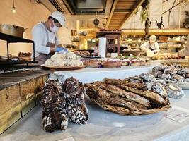 FUKUOKA, JAPAN  NOVEMBER 14, 2023 Breads on the shelf in Dacomecca shop. Dacomecca is a famous bakery shop in Fukuoka. photo