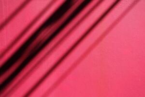 Shadow of Electric Wires on Pink Concrete Wall Texture Background. photo