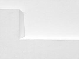 White Stucco Shelf and Wall with Natural Light and Shadow Background. photo