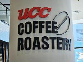 BANGKOK, THAILAND DECEMBER 23, 2023 UCC COFFEE ROASTERY sign. It is a famous Japanese cafe in Bangkok, located at Gateway Ekamai. photo