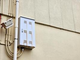 Old Electric Box on the Concrete Wall. photo