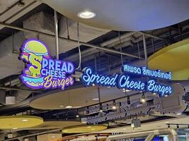 BANGKOK, THAILAND AUGUST 08, 2023 Spread Cheese Burger Sign. Spread Cheese Burger is a burger and pizza shop that located at Seacon Bangkae, Bangkok Thailand. photo