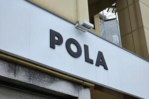 FUKUOKA, JAPAN  NOVEMBER 16, 2023 Pola sign. Pola is a famous Cosmetics brand in Japan, was founded in 1929. photo