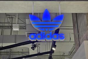 BANGKOK, THAILAND  OCTOBER 31, 2023 Adidas Sign. It is a German athletic apparel and footwear corporation that was founded in August 18, 1949. photo