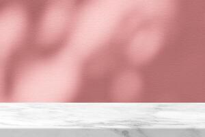 White Marble Table with Bokeh Light on Concrete Wall Texture Background in Light Coral Color Tone, Suitable for Product Presentation Backdrop, Display, and Mock up. photo