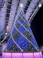 FUKUOKA, JAPAN  NOVEMBER 13, 2023 Big christmas tree in front of Hakata Station. Hakata Station is a major railway station in Hakata ku, Fukuoka, Japan. photo