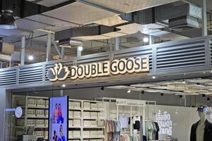 BANGKOK, THAILAND AUGUST 17, 2023 Double Goose Sign. Double Goose is a famous T-Shirt shop in Thailand. photo