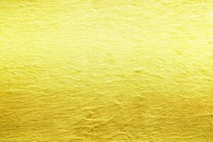 Abstract Golden Stucco Wall Texture Background, Suitable for Backdrop and Mockup. photo