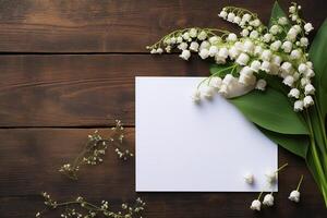 AI generated mockup white blank paper sheet with lilies of the valley flowers top view on wooden background, floral template empty card flat lay for design with copy space photo