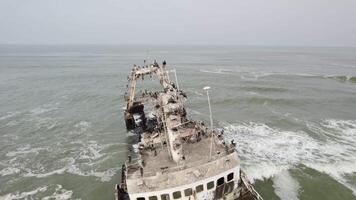 Shipwreck off the coast of Africa. Rusty Ship video