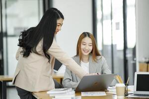 Working women are discussing work and planning new business plans by exchanging ideas with colleagues. photo