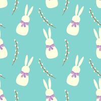 Seamless pattern of white Easter bunnies and willow branches on blue background. vector