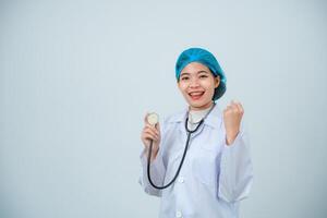 Portrait asian doctor woman, intern with holding stethoscope and medical robe, professional, looking confident at camera, grey or white background. photo