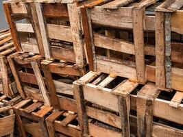 piles of empty wooden boxes in traditional markets photo