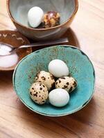 Quail eggs in a bowl photo
