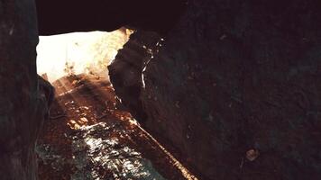 Shaft of light beaming down into large cave video