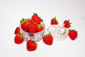 Many strawberries in a glass cup photo