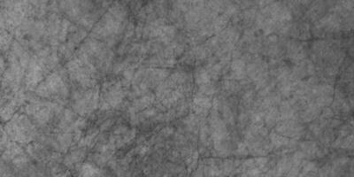 dark black grunge textured blackboard or chalkboard, monochrome slate grunge concrete wall or plaster, distressed overlay concrete asphalt texture, grainy old distressed grunge background in black. photo