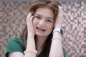 Young woman with toothache, dental problem. Health care concept. photo