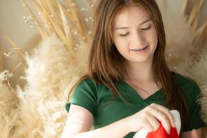 Portrait of Teenage girl with Santa hat. photo