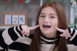 Portrait of Teenage girls with braces on her teeth photo