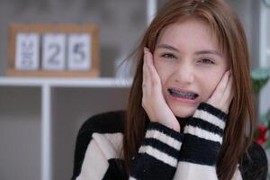 Portrait of Teenage girls with braces on her teeth photo