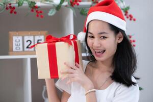 Portrait of Teenage girl with Christmas gift box. photo