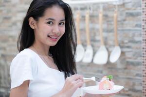 Portrait of a young asian woman with braces on her teeth photo