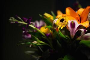 Still life. luxury spring flowers on a black background. color bloom. Low key photo