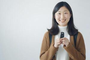 AI generated Smiling woman pose with car key in her hands studio shot .Rental automotive business concept .Used car concept .Car insurance concept . photo