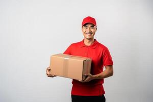 AI generated young Asian deliveryman is holding delivery box , logistics concept . photo