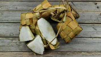 Selected Focus Ketupat Lebaran, served with Sambal Goreng Kentang, Opor Ayam and Telur Semur. Traditional Celebratory Menu during Eid al-Fitr and Eid al-Adha in Indonesia photo