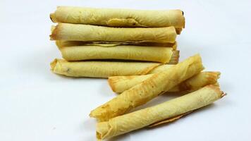 egg roll biscuit isolated on white background. Biscuits served during Ramadan and Eid al-Fitr photo