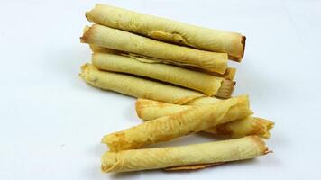 egg roll biscuit isolated on white background. Biscuits served during Ramadan and Eid al-Fitr photo