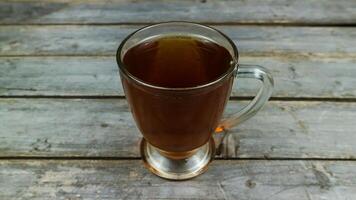 A cup of tea on a gray table, lying flat photo