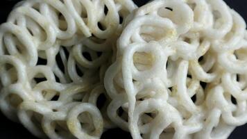 Krupuk or kerupuk Indonesian are deep fried crackers made from starch and other ingredients that serve as flavoring. photo