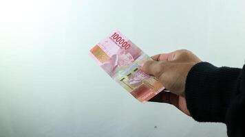 Hand hold money rupiah,transaction concept, financial concept photo