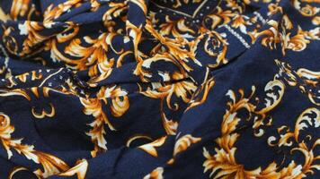 A traditional Indonesian fabric, namely batik cloth which has unique and different patterns and image motifs for each region. Cultural theme photos, typical of Asia. photo