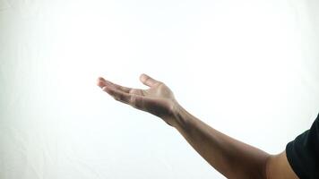 Human hand in choosing gesture isolate on white background with clipping path. Hand symbol reaching for something, A palm in front of black background photo