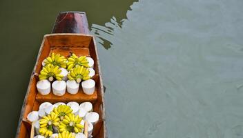 Tropical fruits for sale on floating market photo