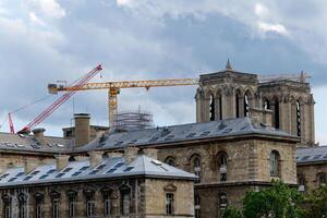 View of Notre Dame de Paris in France. A Gothic building constructed during Medieval times, is home to a number of sculptures, including many gargoyles. photo