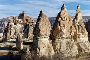 View of the natural beauty of the Rose Red Valley in Cappadocia, Turkey. Famous destination for hikers to explore the Rock Sites of Cappadocia. photo