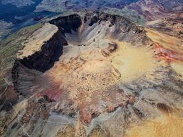 Aerial view of Pico Viejo volcano in Tenerife, Canary Islands, Spain. Pico Viejo has a spectacular 800 meters diameter crater. Famous destinations for hikers. photo