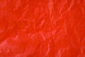 Red crumpled paper texture photo