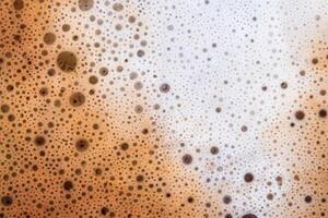 Surface texture of hot milk coffee and soft froth photo