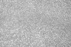 Abstract blur silver glitter sparkle defocused bokeh light background photo