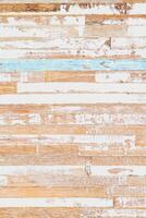The background of weathered painted wood. Old scratched wooden planks with some cracks. Grunge rusty wood texture background of old dirt scratched wooden planks. Vertical. photo