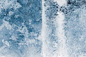 Ice blocks surface, blue toned. Ice texture background. Textured cold frosty surface of ice blocks. photo